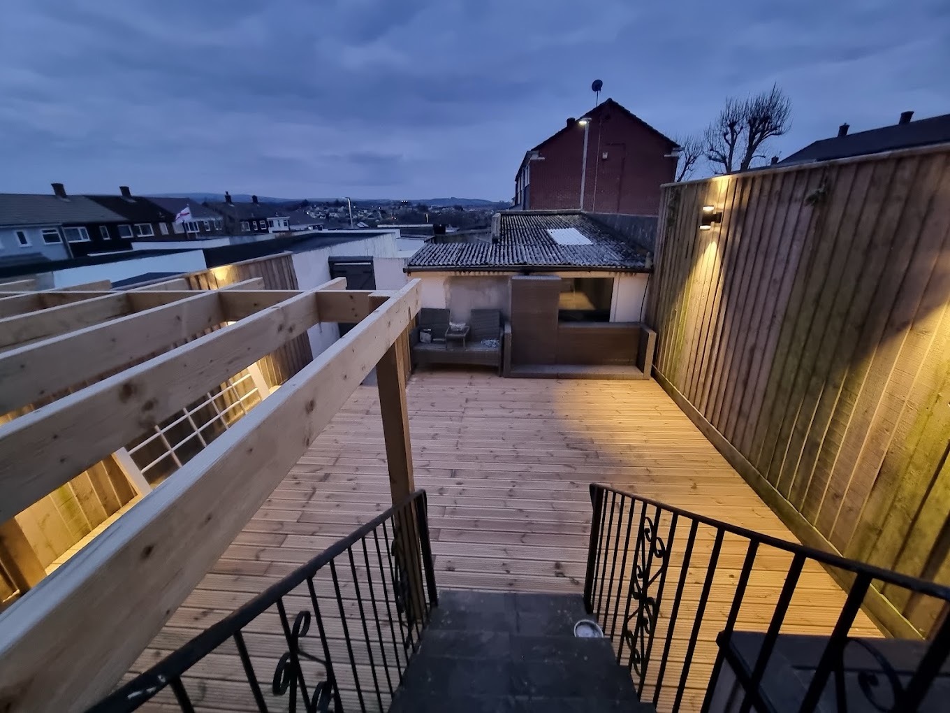 Timber decking with pergola at dusk