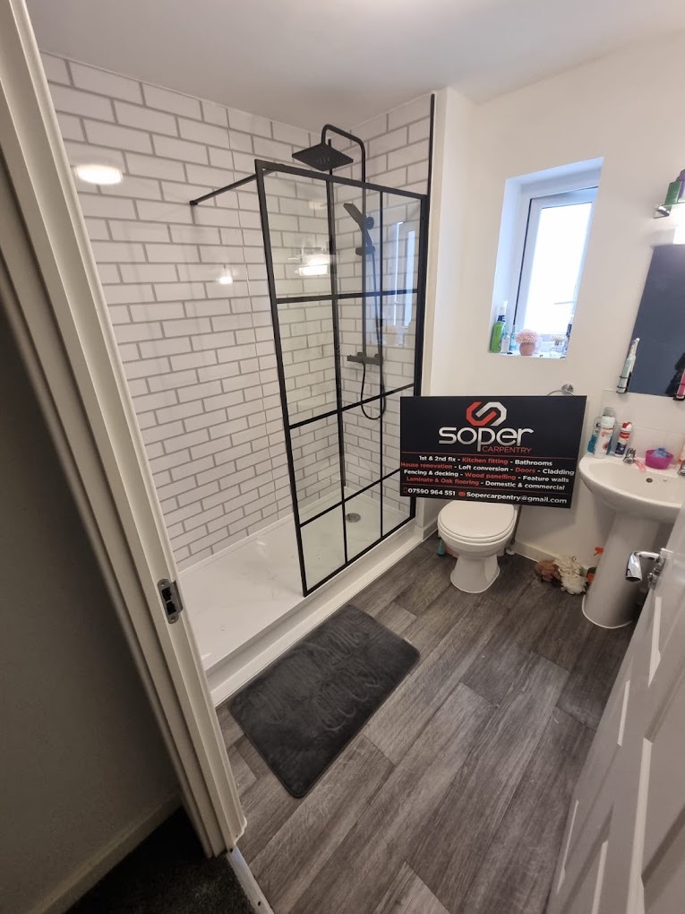 Modern bathroom with black-framed walk-in shower
